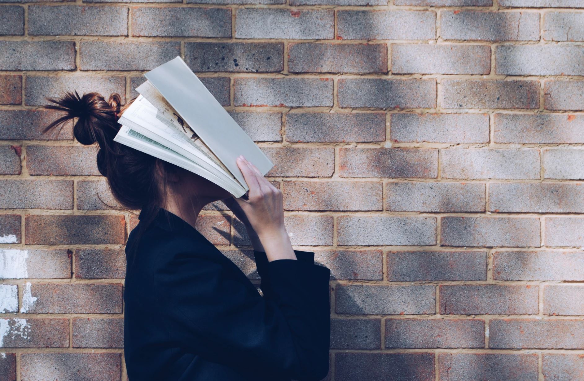 A student with a book | Siora Photography/Unsplash